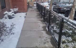 Cleared and salted sidewalk for safe pedestrian access during winter
