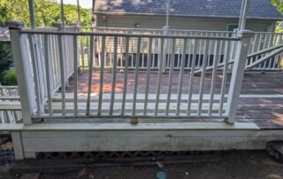 Weathered wooden deck with faded paint before professional restoration