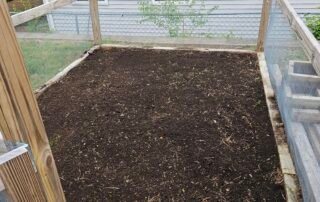 Freshly prepared garden bed with new soil ready for planting